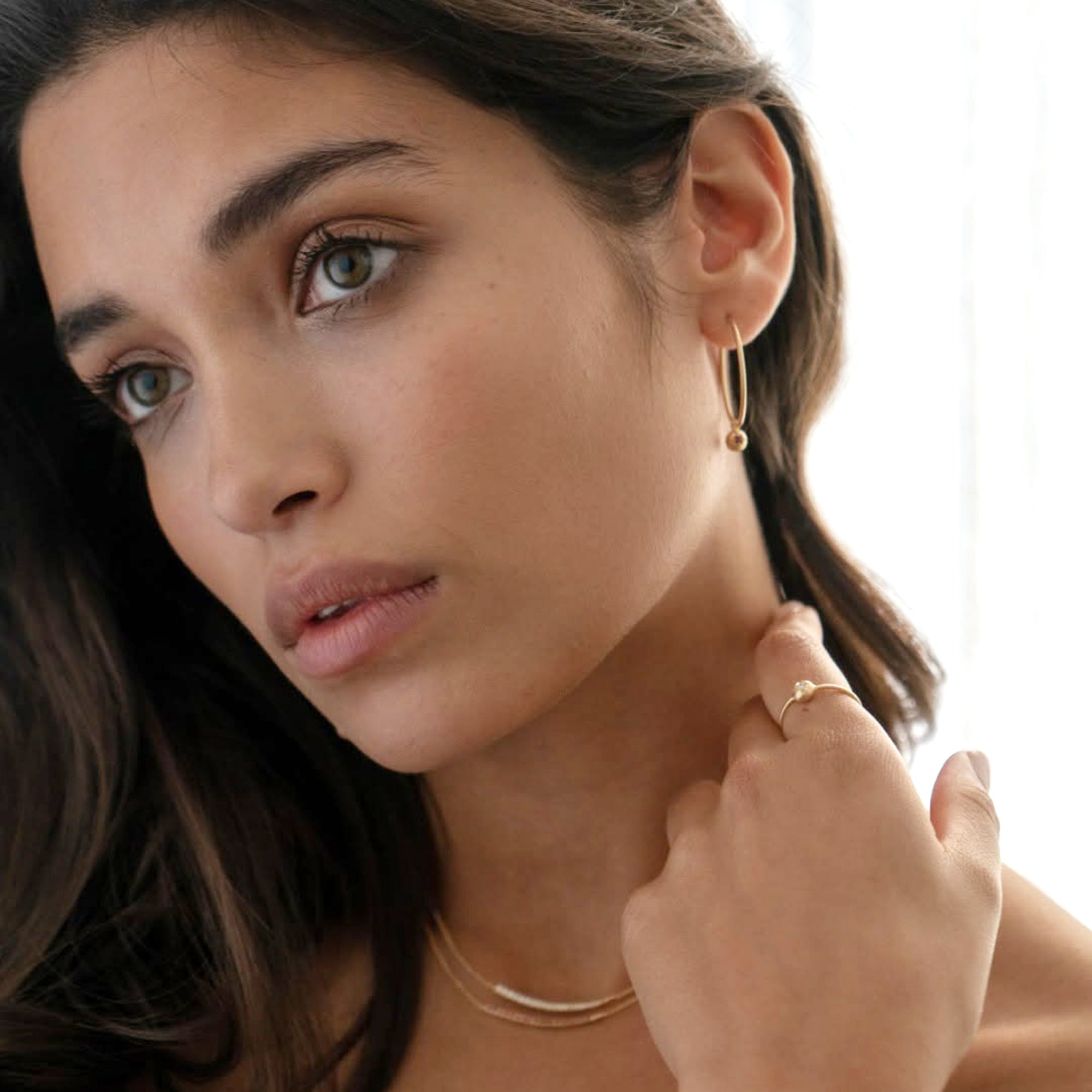 Model wearing Eloise Italian handcrafted diamond necklace, hoop earrings and ring