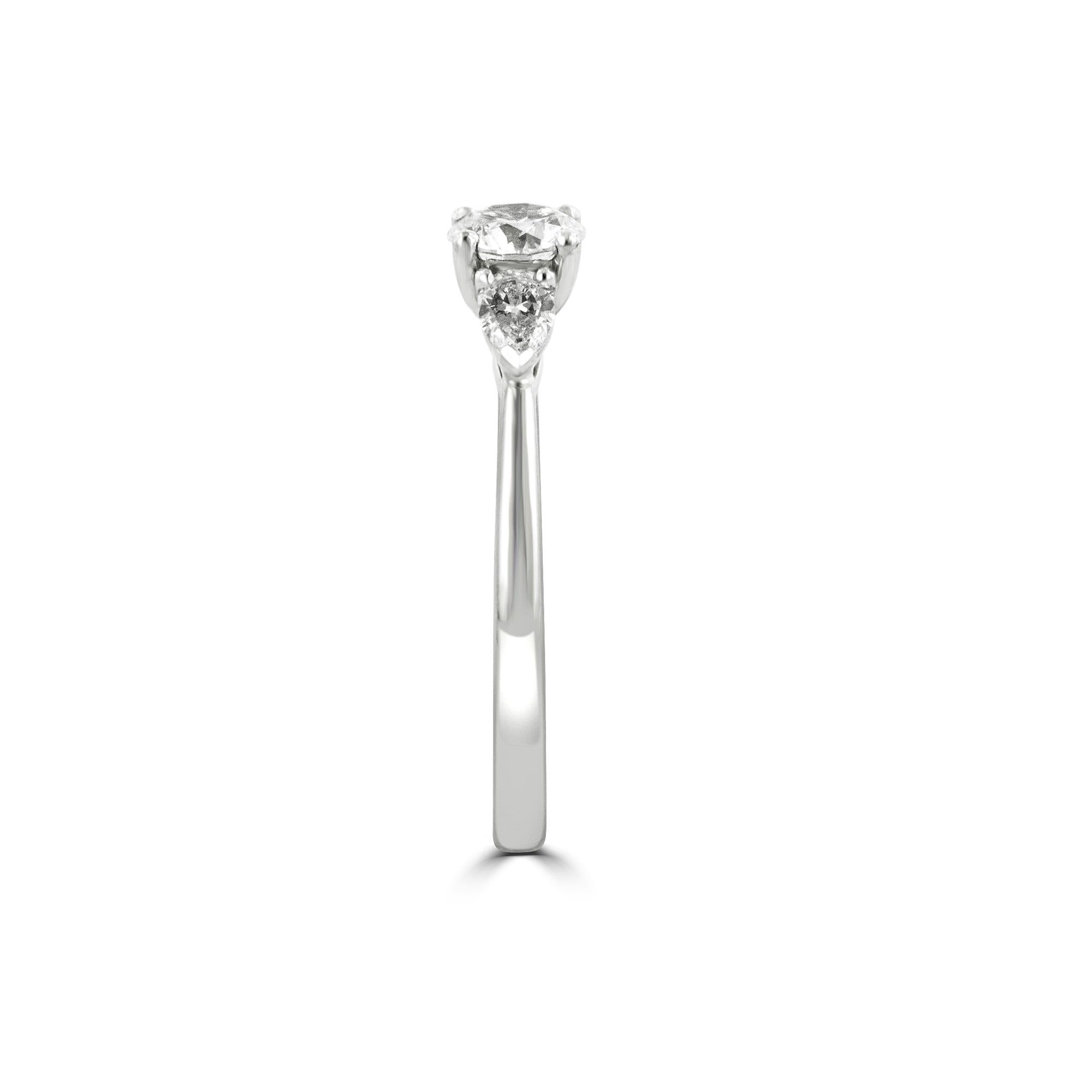 Round and Pear Shape Diamond Three Stone Ring in Platinum