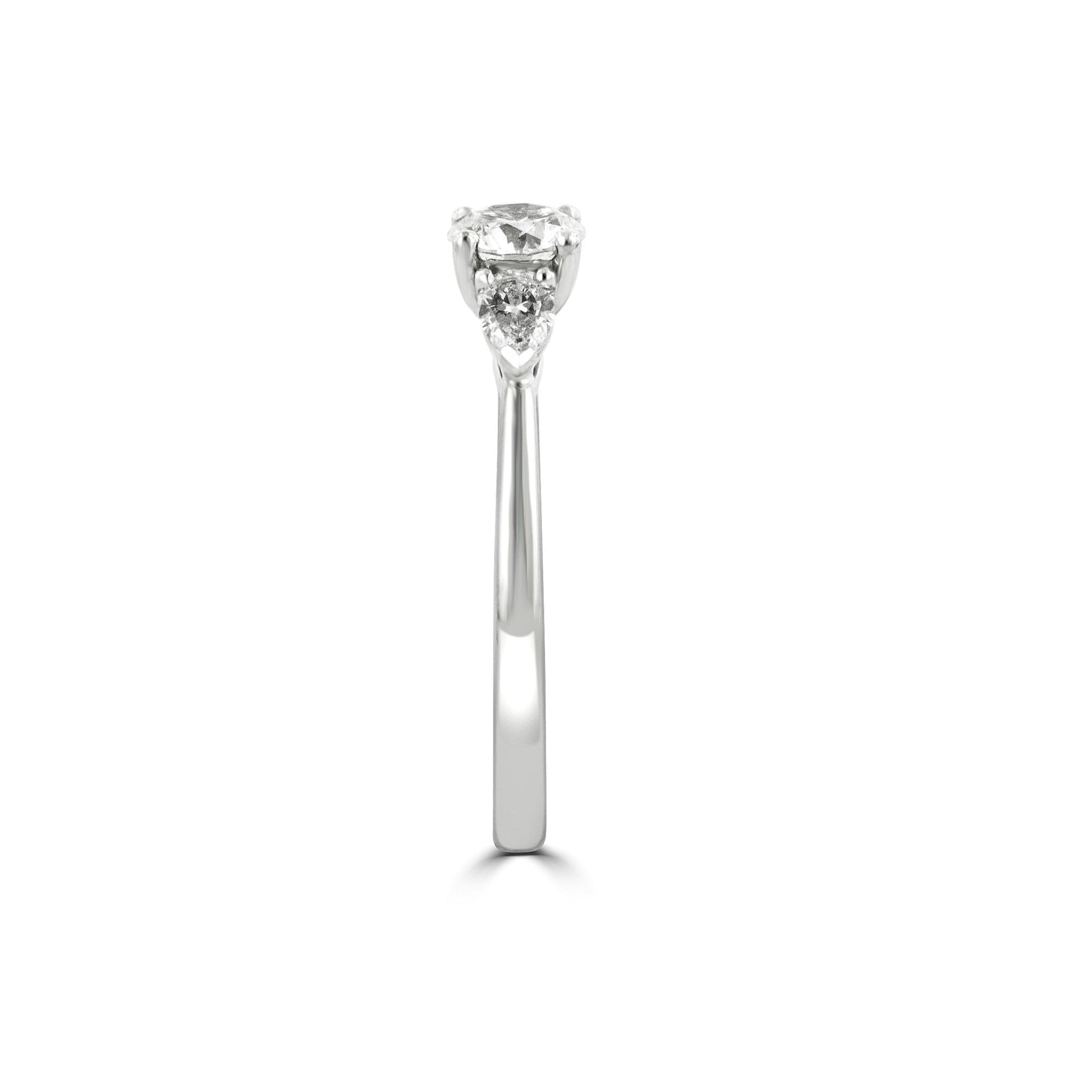 Round and Pear Shape Diamond Three Stone Ring in Platinum