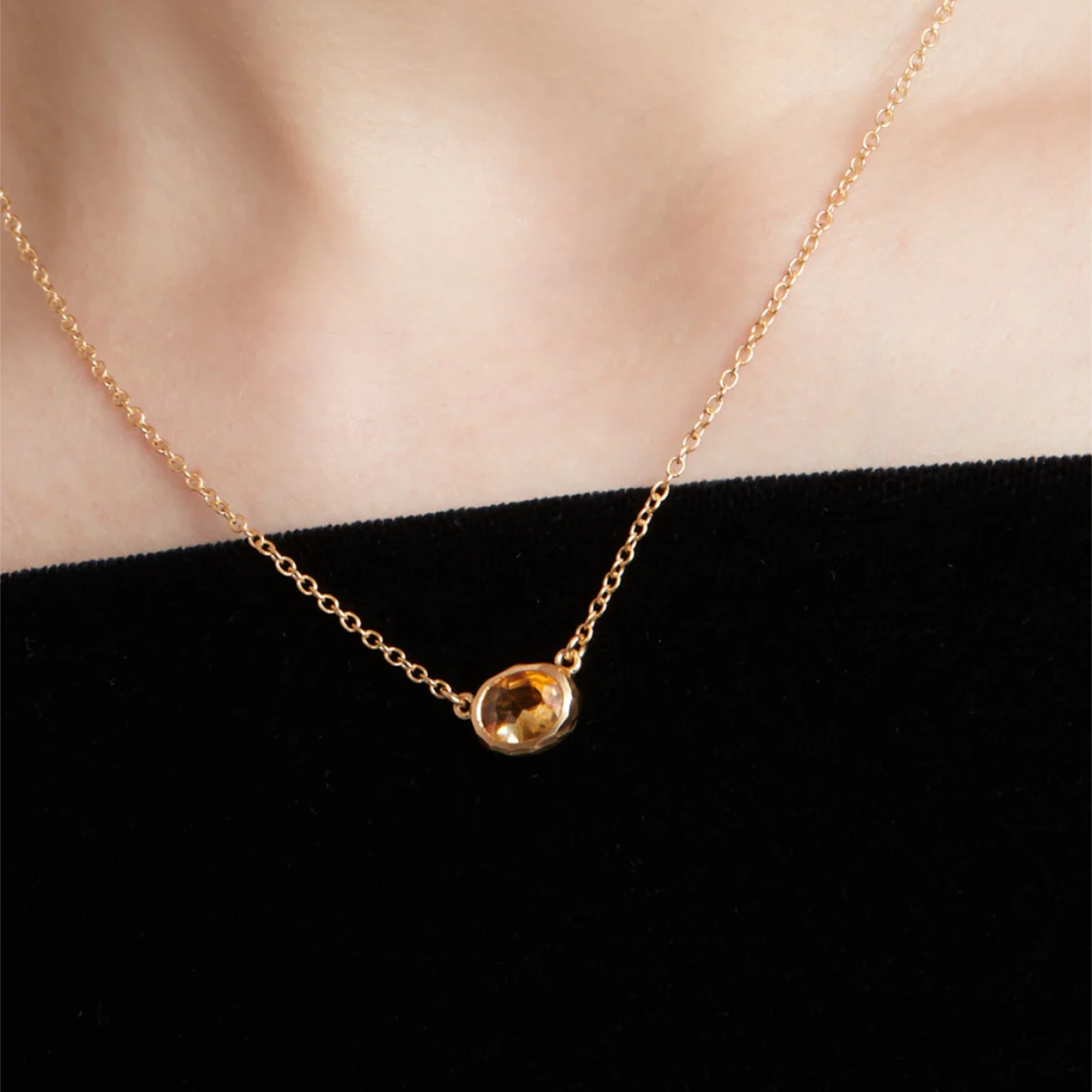 Model wearing an Eloise 18ct Gold Plated Sterling Silver Yellow Citrine Quartz Ellipse Necklace - rubover set faceted oval citrine quartz 