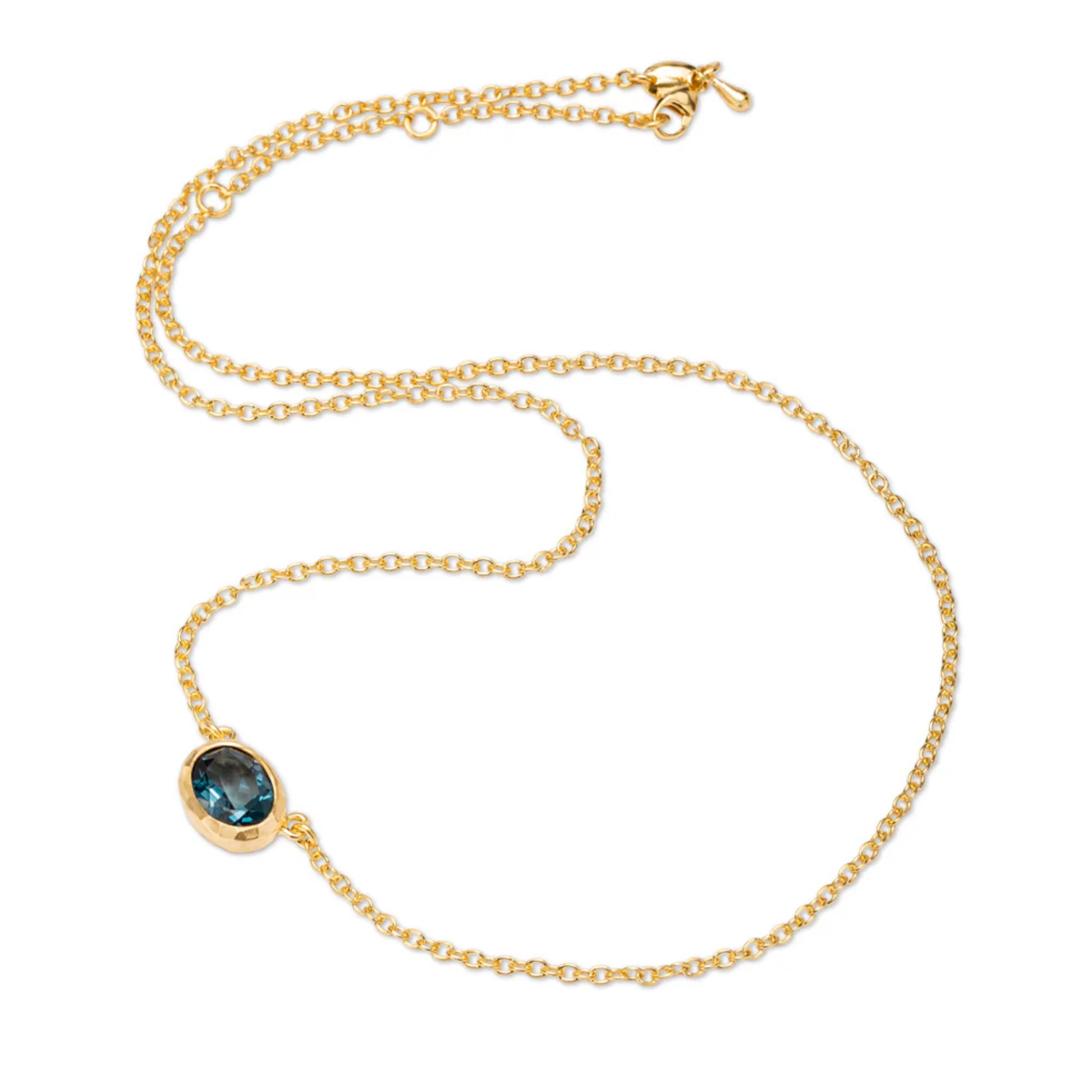 Eloise 18ct Gold Plated Sterling Silver oval Deep Blue Topaz Ellipse pendant fixed to trace chain