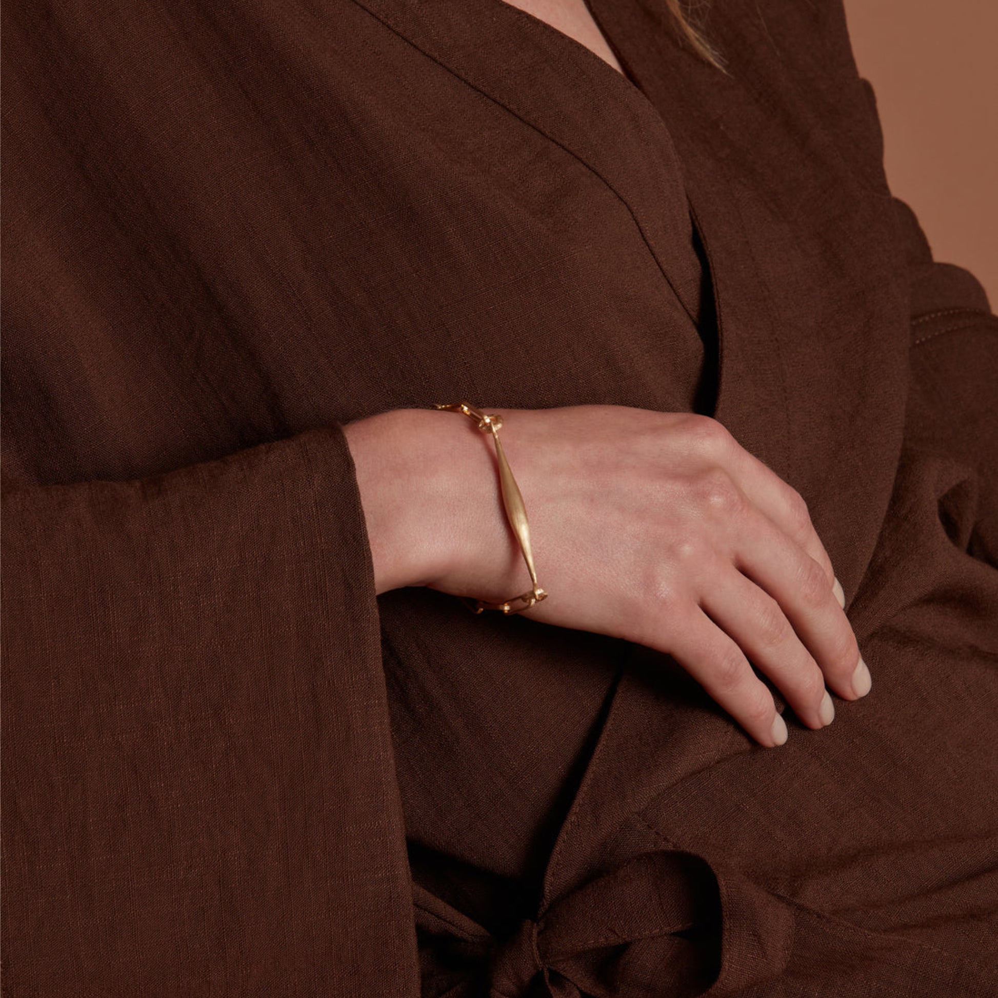 Eloise Gold Plated Sterling Silver Spindle Bracelet featured on a models wrist