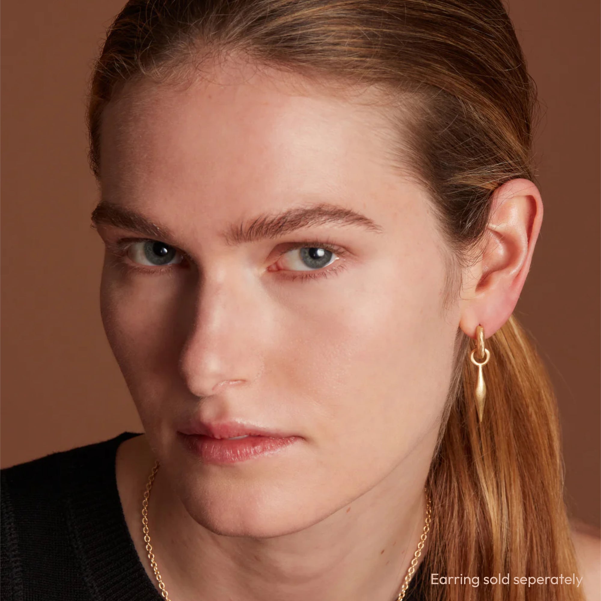 Model Wearing Eloise Gold Plated Sterling Silver Small Spindle Charm on Hoop Earring