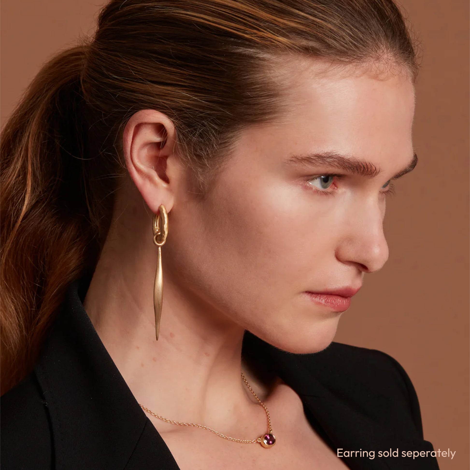 Model Wearing Eloise Gold Plated Sterling Silver Large Spindle Charm on Hoop Earring and Ellipse Necklace