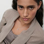 model wearing letter M necklace with cz in silver