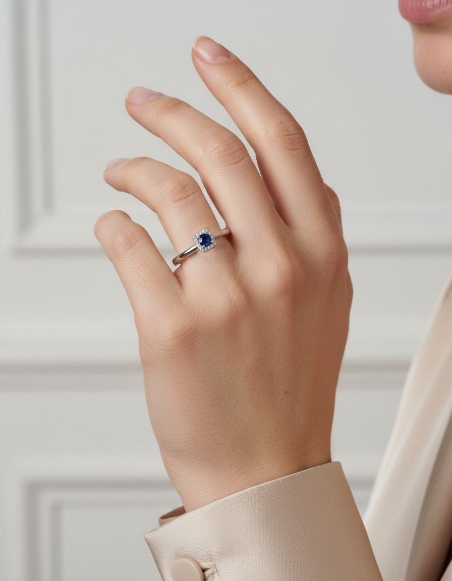Platinum Dress Ring with 0.64ct Round Brilliant Cut Sapphire And Diamond Halo