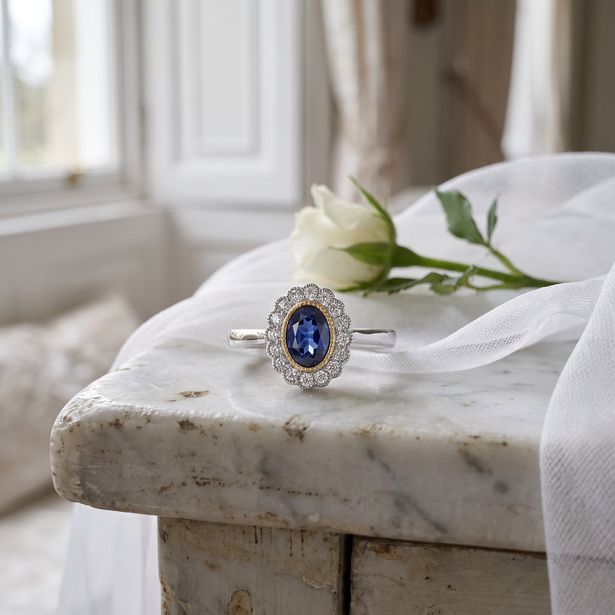 Platinum & Gold Oval Sapphire and Diamond Halo Ring
