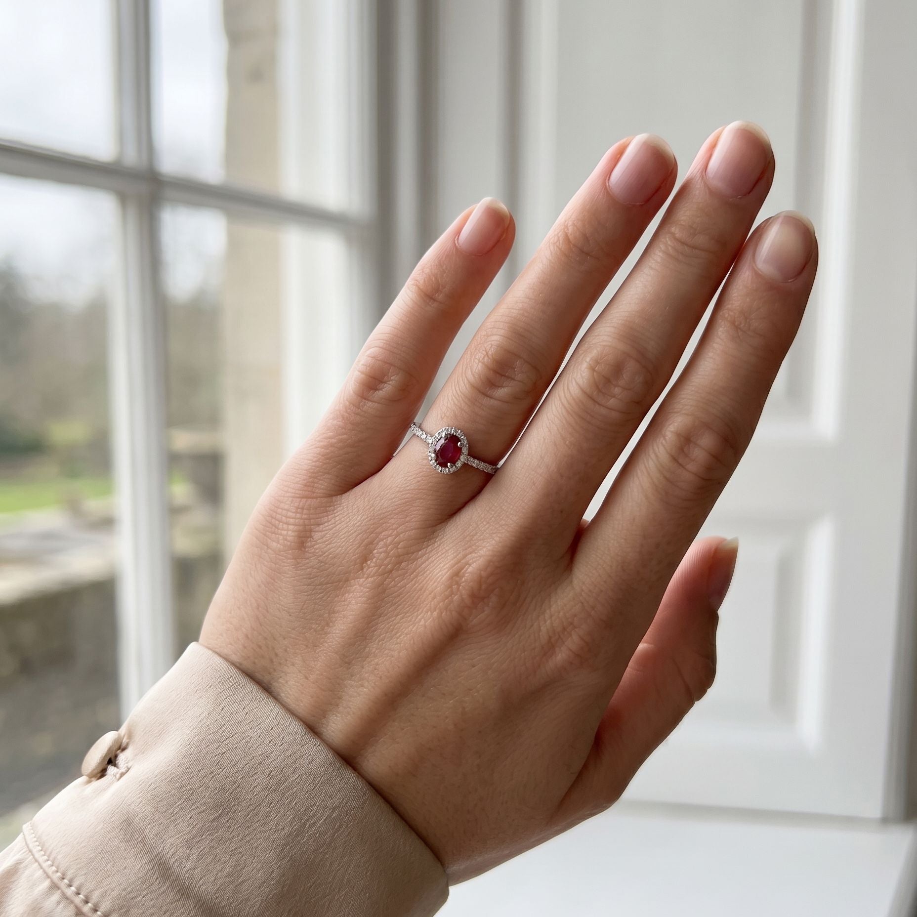 Platinum Oval Cut Madagascan Ruby and Diamond Halo Ring