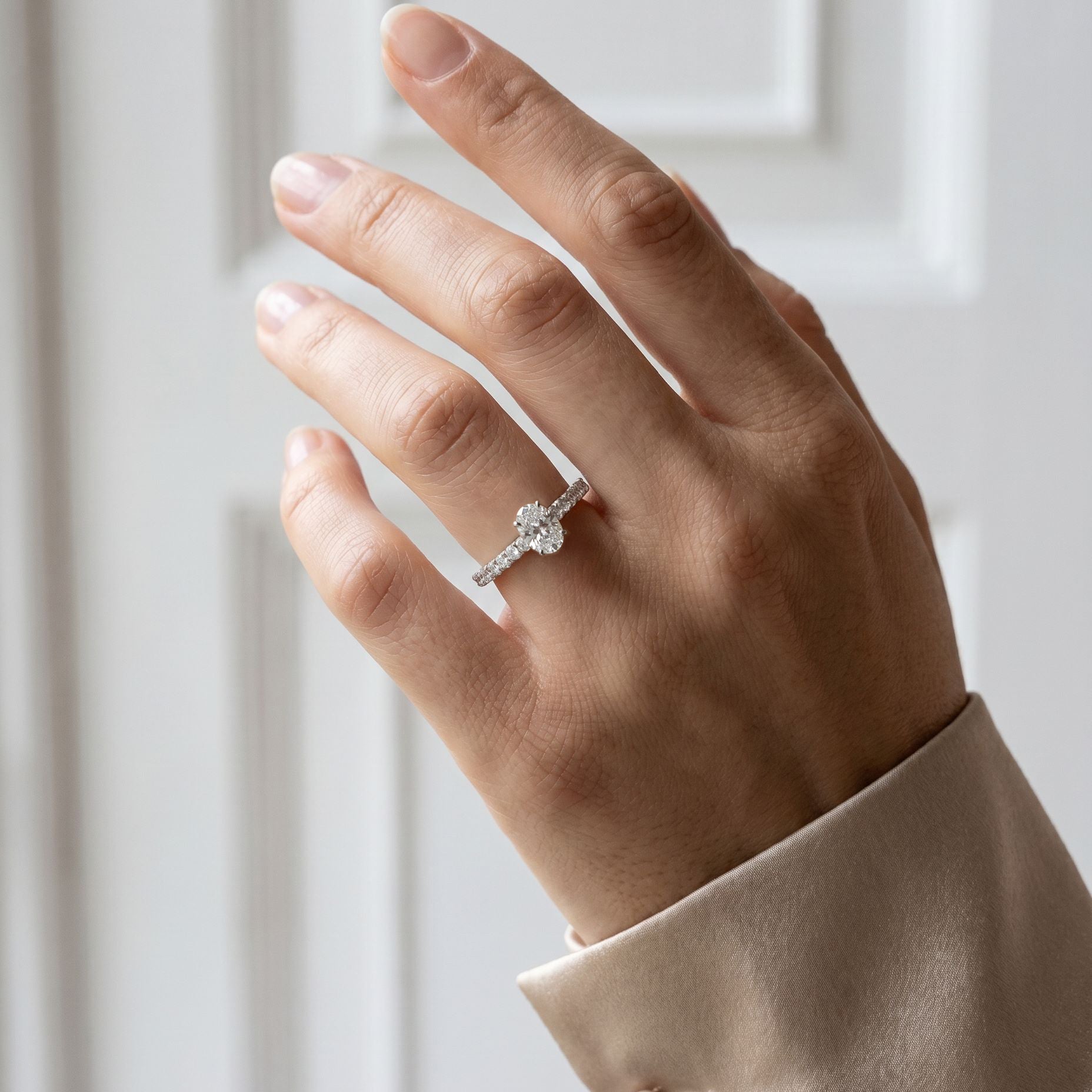 Platinum Oval Natural Diamond Four Claw Engagement Ring With Diamond Shoulders