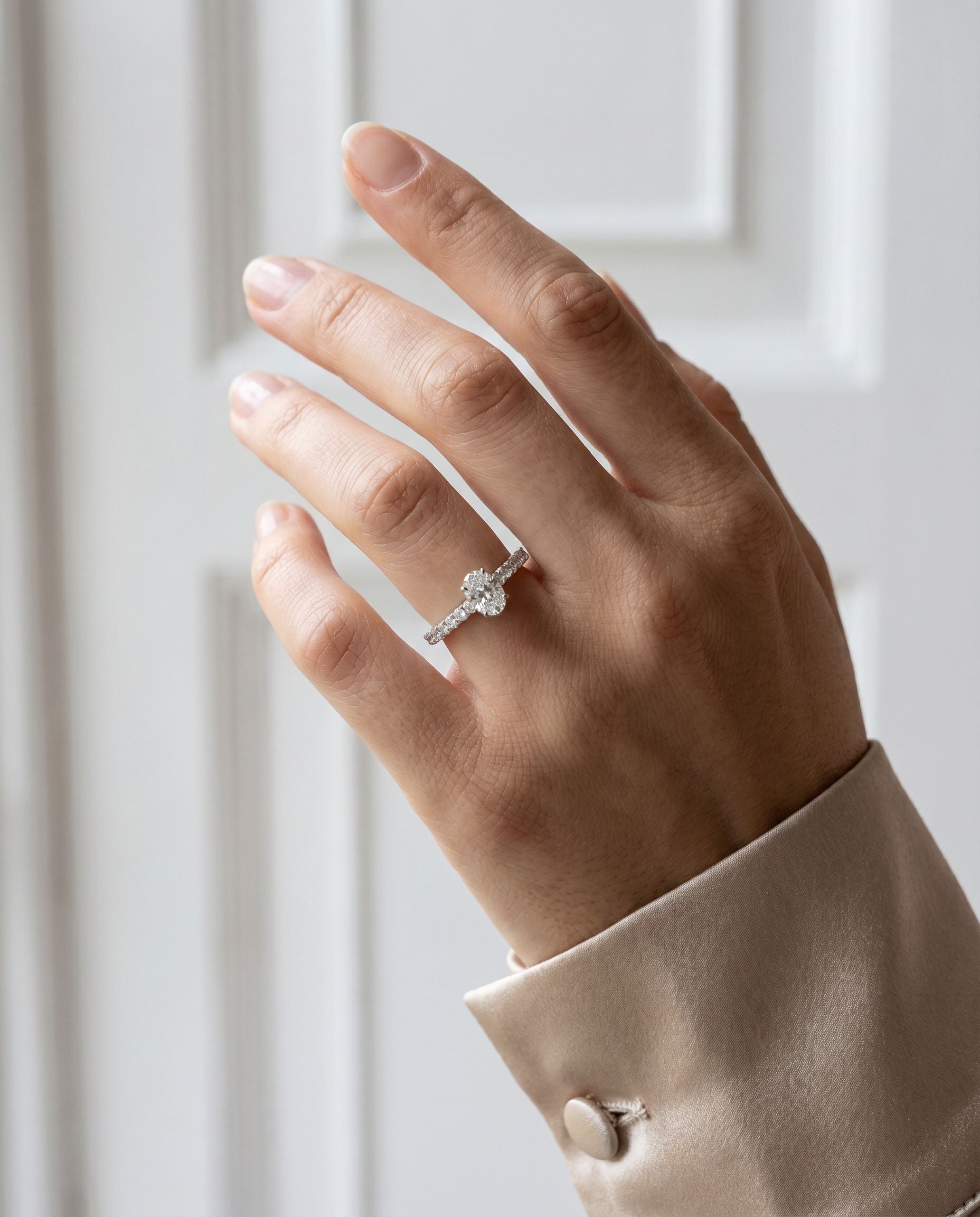Platinum Oval Natural Diamond Four Claw Engagement Ring With Diamond Shoulders