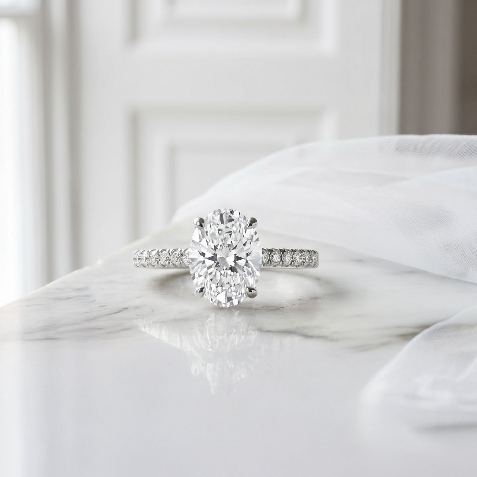 Platinum Oval Natural Diamond Four Claw Engagement Ring With Diamond Shoulders