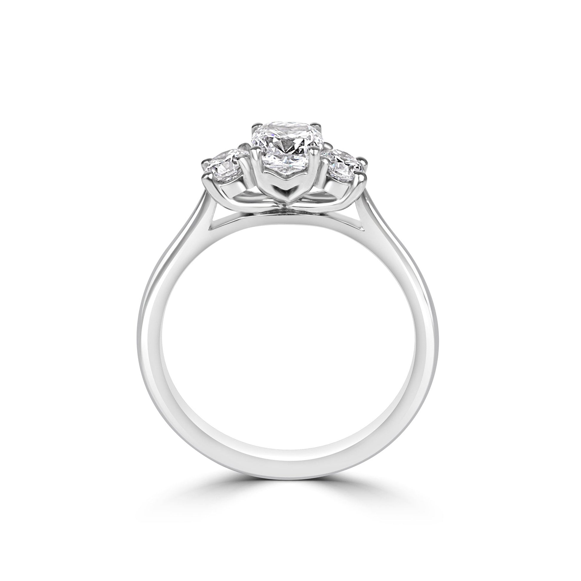 Platinum Three Stone Ring With 0.70ct Cushion Diamond and Round Diamonds
