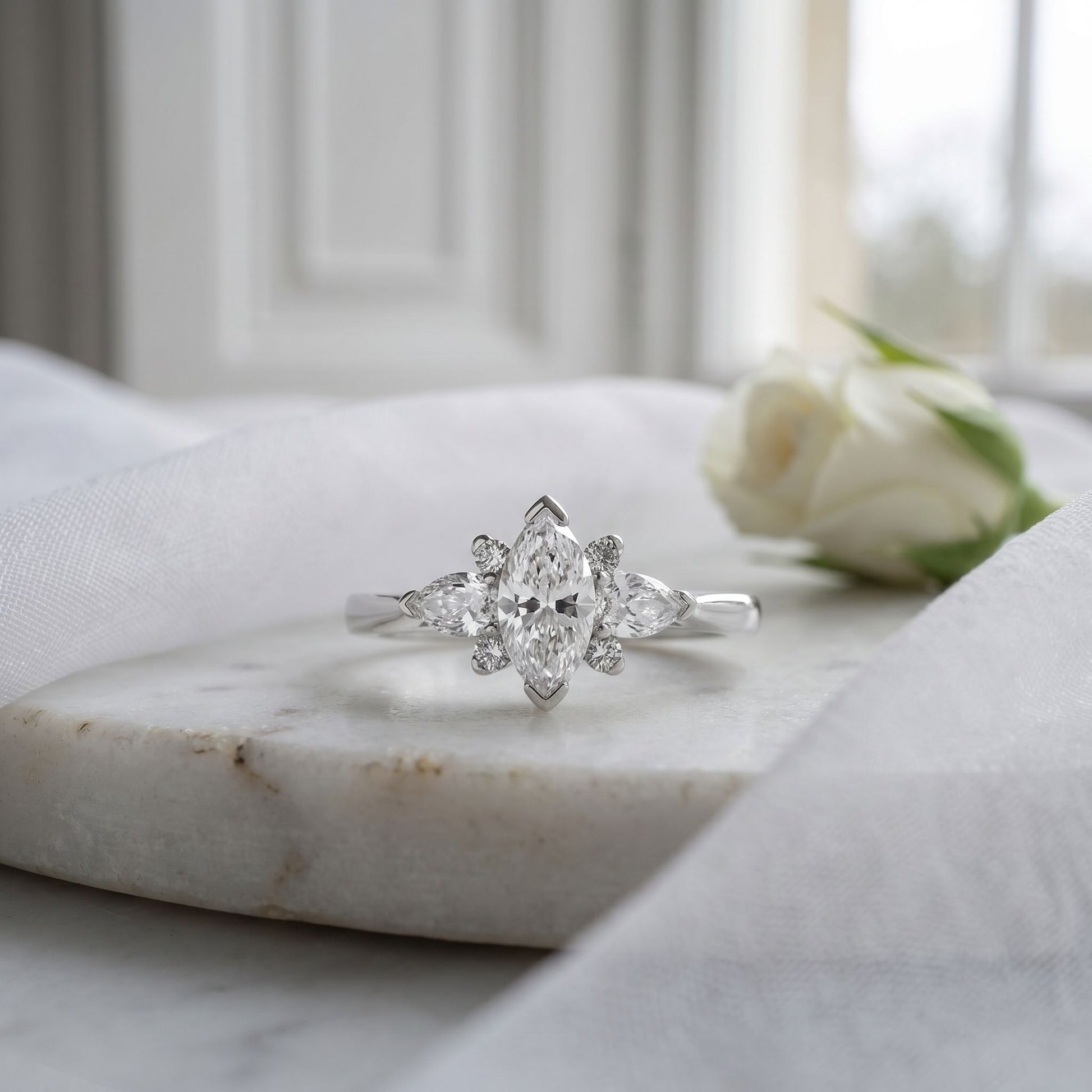 Platinum Unique Marquise, Pear and Round Diamond Ring