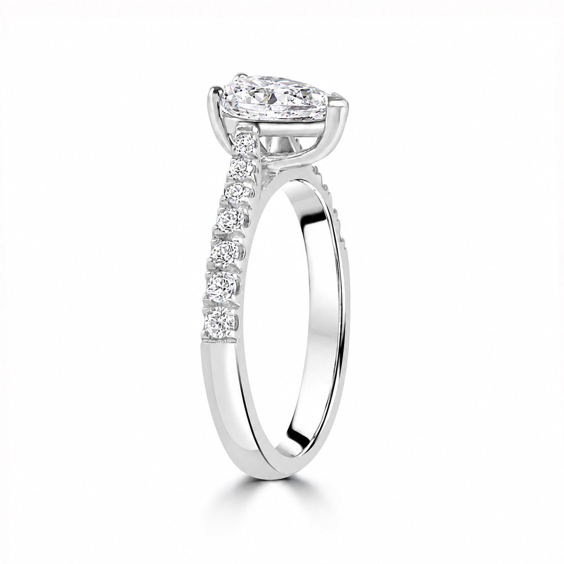 Silver Pear Cut CZ Ring with Graduated Claw Set Shoulders
