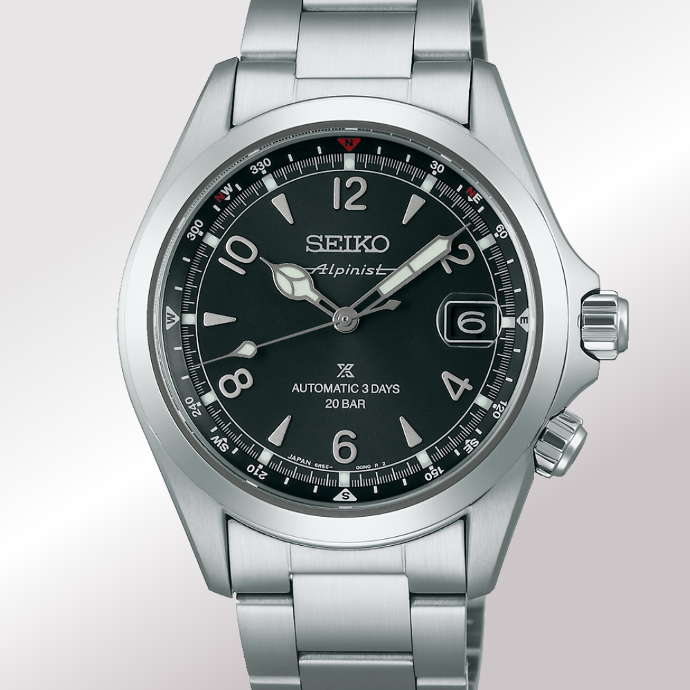 A Seiko Alpinist Automatic 3 Days 20 Bar watch with a silver stainless steel case and bracelet, featuring a black dial with white hands, markers, and a date window.